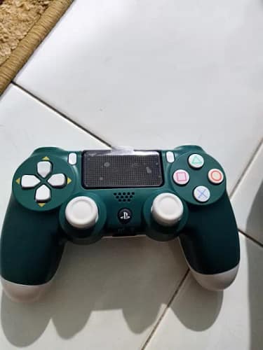 Click to view full screen Sony PlayStation DualShock 4 Wireless Controller for PlayStation 4 - Alpine. Green photo review